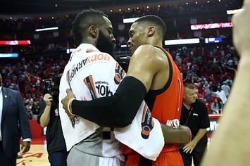 James Harden and Russell Westbrook embrace after a game.