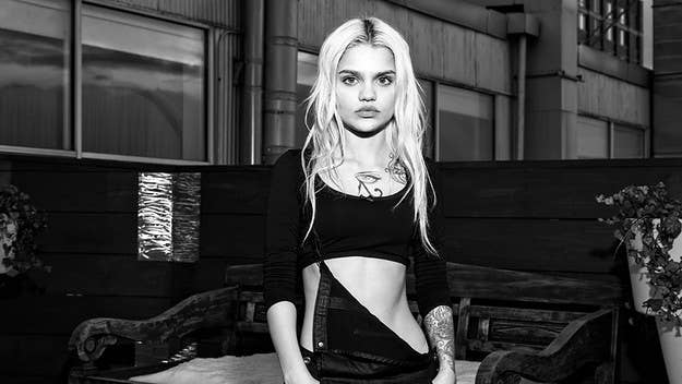 In an exclusive interview, model and video vixen Amina Blue reveals how involved Carine Roitfeld was with the show and why models were projected onto a screen.