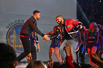 Drake introduces Stephen Curry #30 of the Western Conference