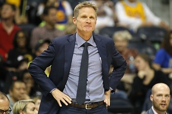 Steve Kerr reacts to a call during a Warriors game.