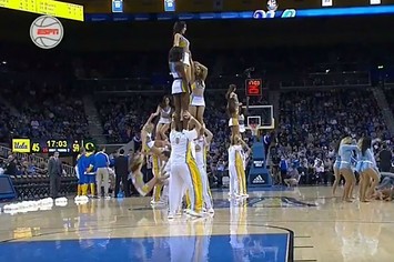 UCLA cheerleader takes a hard fall.