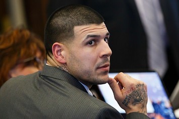 Aaron Hernandez listens during his double murder trial.