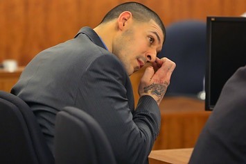 Aaron Hernandez sits in a courtroom during his murder trial.