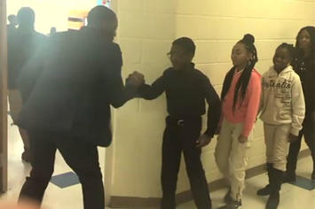 A Charlotte, NC teacher dishes out personalized handshakes to each student.