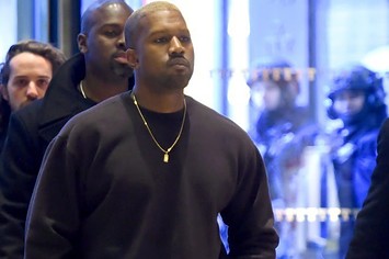 Kanye West walks into Trump Tower.