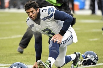Russell Wilson warms up before a game.