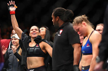 Amanda Nunes celebrates her victory over Ronda Rousey at UFC 207.