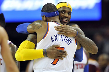 LeBron James and Carmelo Anthony hug one another.