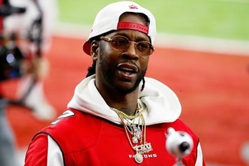 2 Chainz rocks Falcons gear at game.