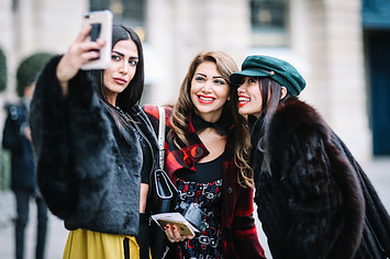 Soraya Shawsky, Maya Williams, and Thythu take a selfie, outside the Alexis Mabille show