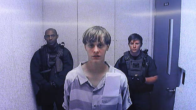 A new report reveals Dylann Roof displayed racist symbols on his shoes during trial.