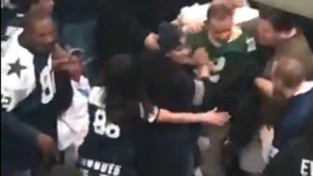 A Packers fan in an Aaron Rodgers jersey was violently attacked by Cowboys fans inside AT&T Stadium following Sunday’s playoff game.