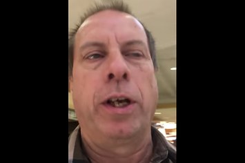 A screen shot from a YouTube video showing a pastor yelling at kids about Santa.