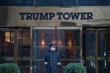 A doorman stands in front of Trump Tower during the Women's March