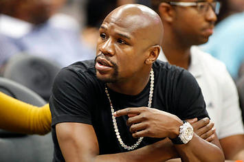 Floyd Mayweather attends an NBA game.
