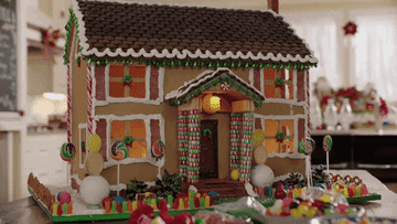 A big gingerbread house decorated with sweets