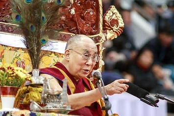 Dalai Lama speaks to worshippers during ceremonies at the Buyant Ukhaa sports stadium in Ulan Bator