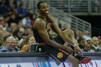 Dwight Howard prepares to check in to a game for the Hawks.