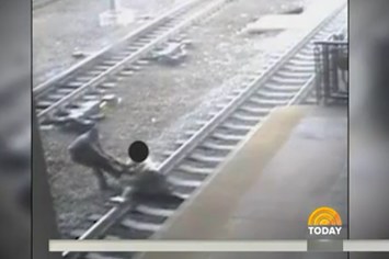 Cop saves man from train
