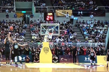 Stephen Curry gets blocked during an exhibition game in China.