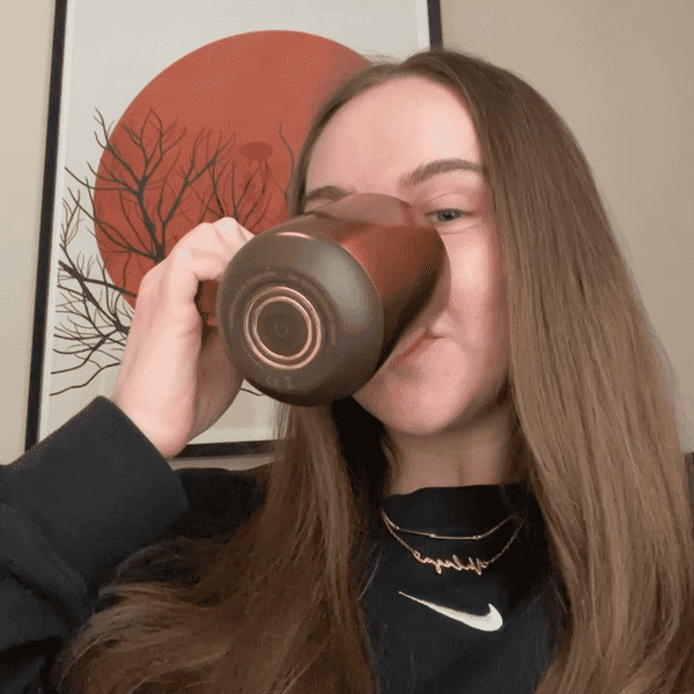 Valeza sipping from her Ember mug