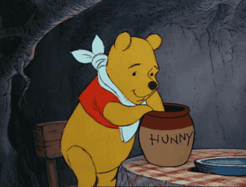 pooh eating &quot;hunny&quot; from a jar