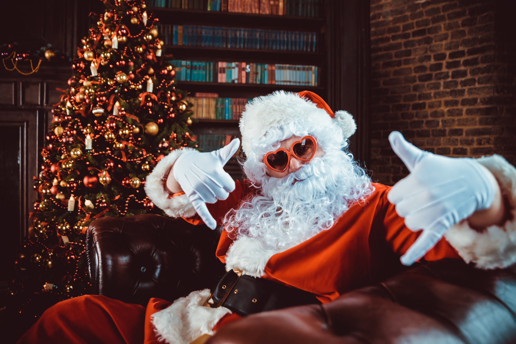 Santa wearing heart-shaped glasses
