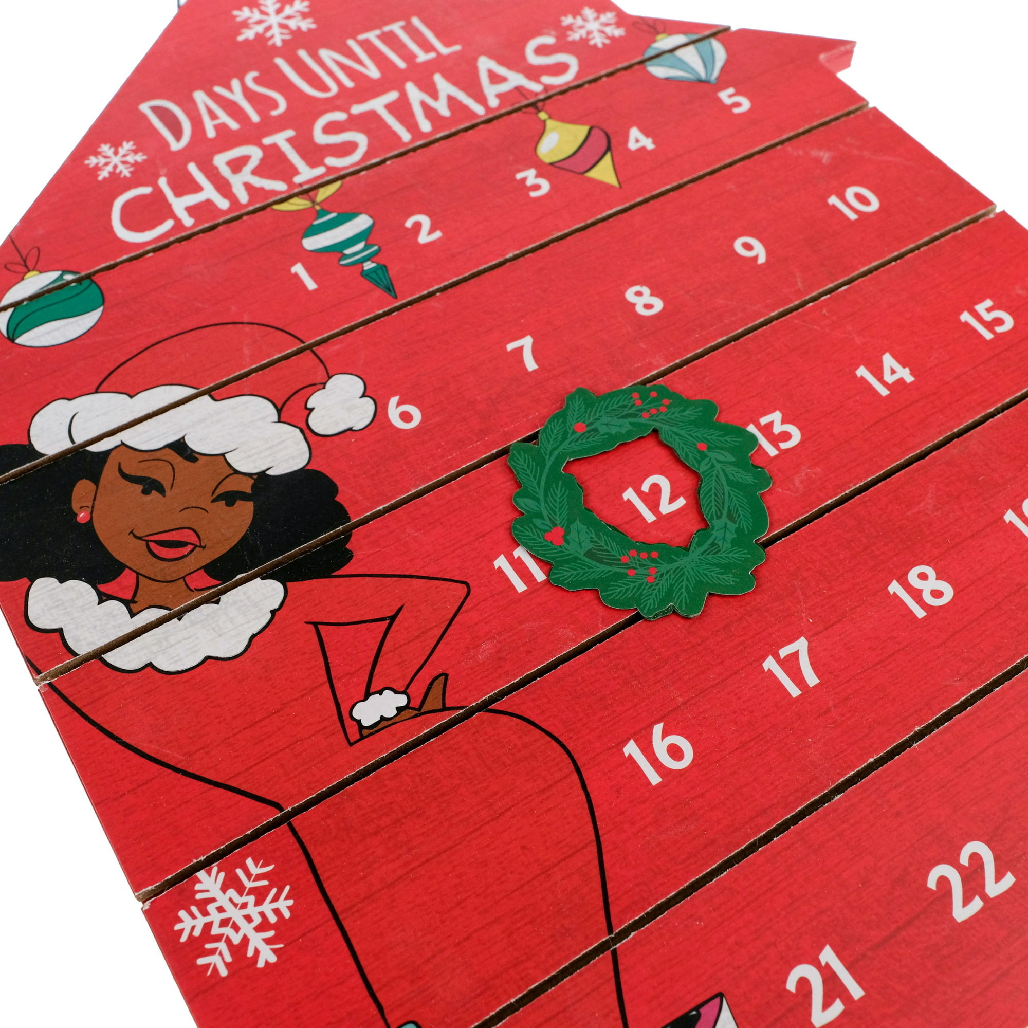 house-shaped advent calendar with a movable wreath and illustrated woman in a santa-themed dress