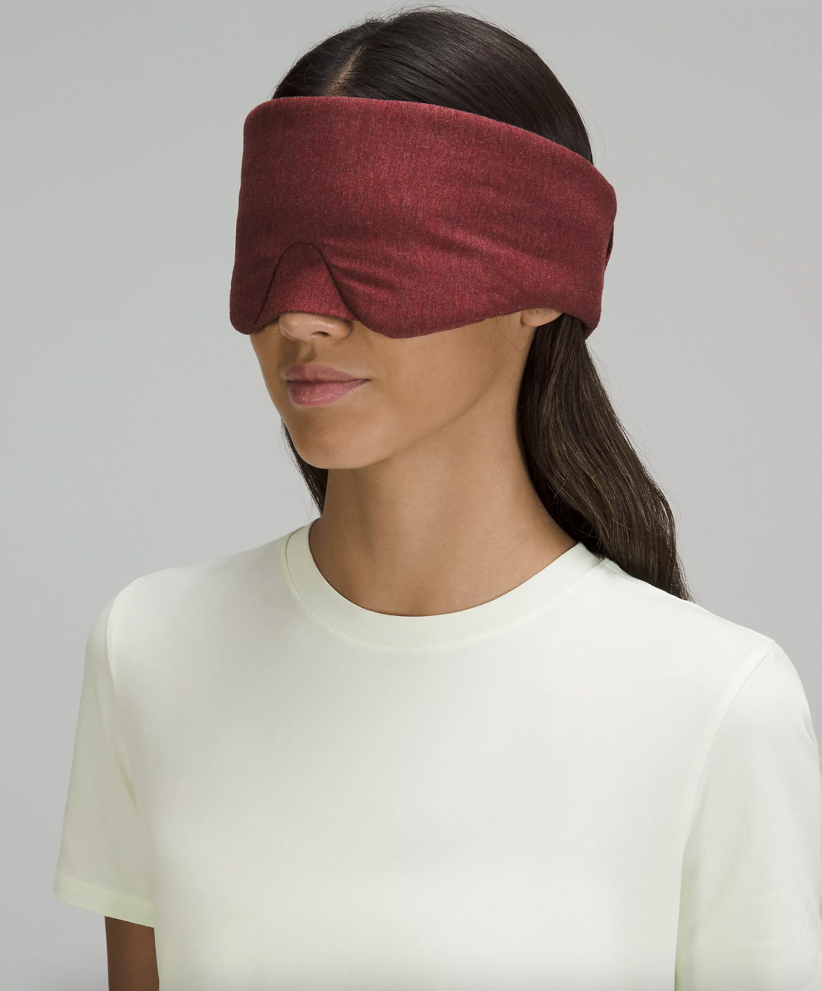 a person wearing the padded eye mask over their face