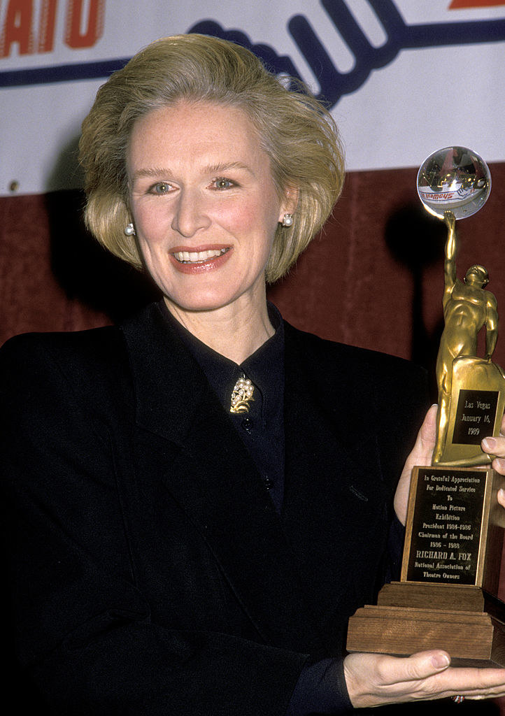 Close-up of Glenn holding an award