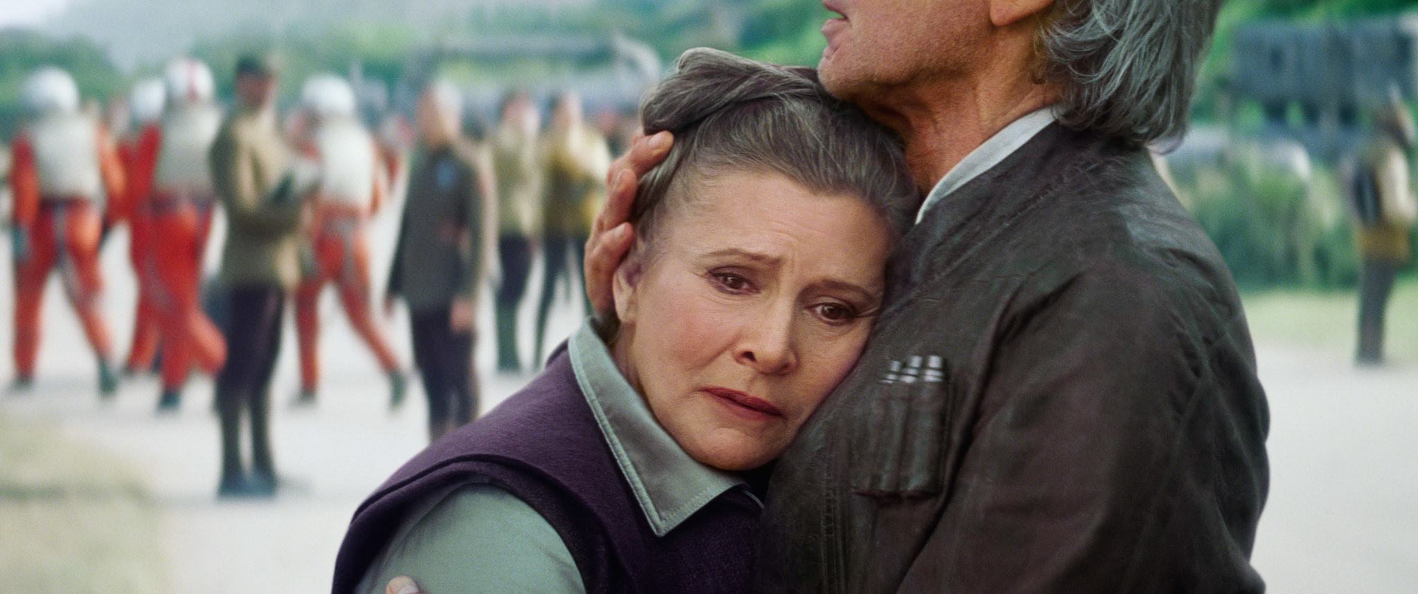 Carrie Fisher as Leia hugging Harrison Ford as Han Solo