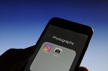 Photography applications are seen on an iPhone.