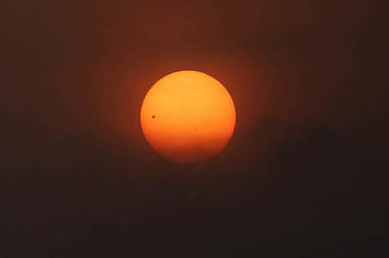 Planet Venus is pictured during the transit across the sun.