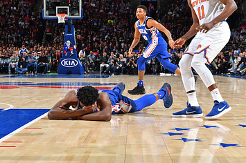 oel Embiid #21 of the Philadelphia 76ers lays on the court.