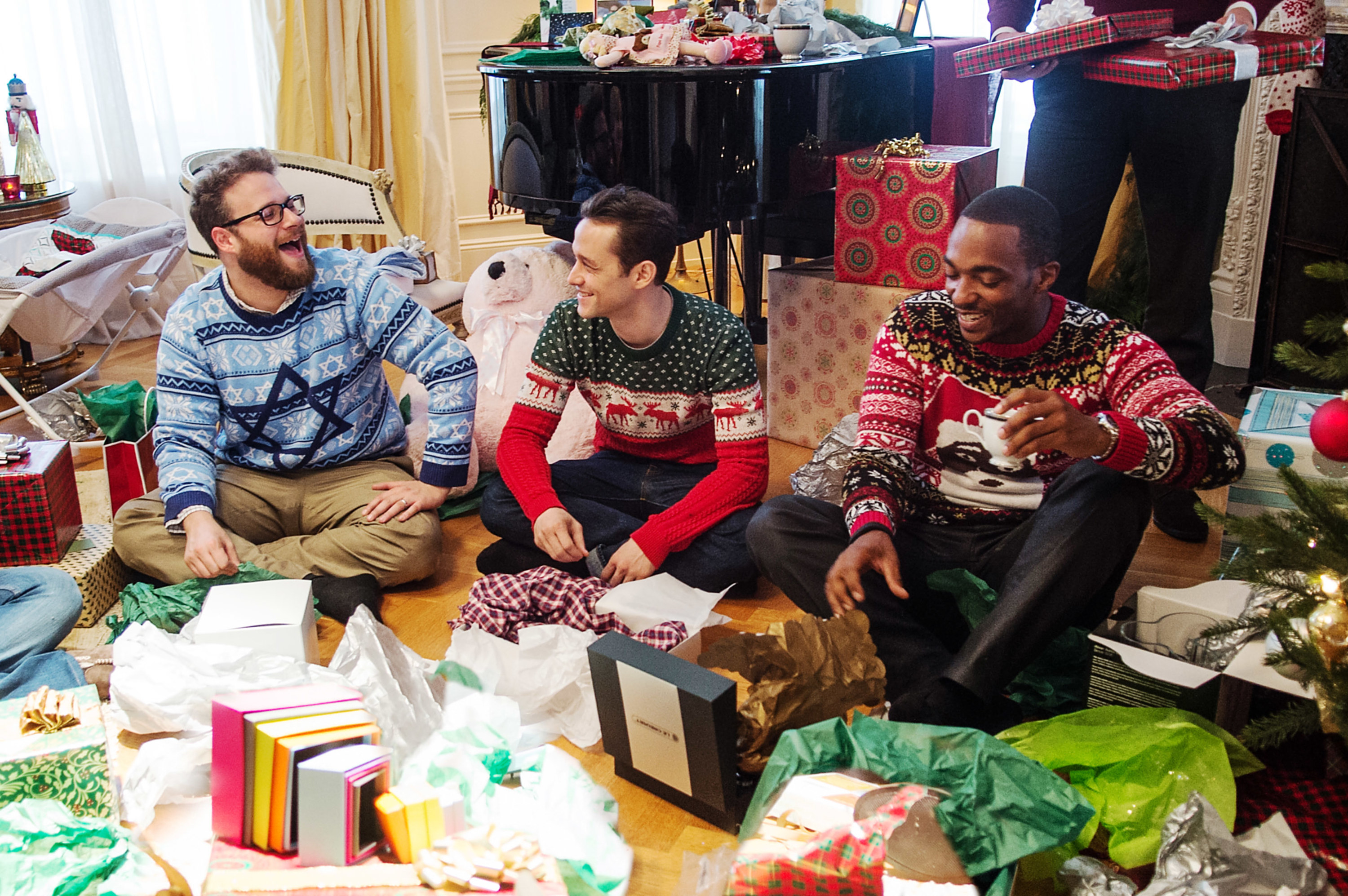 three friends opening presents