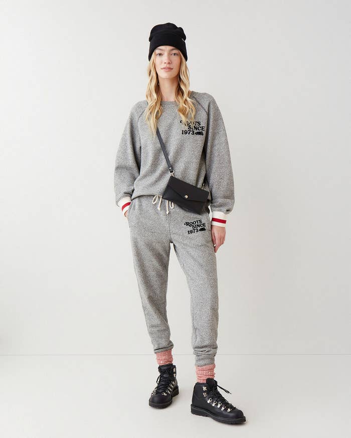 a person wearing the sweat suit in front of a plain background