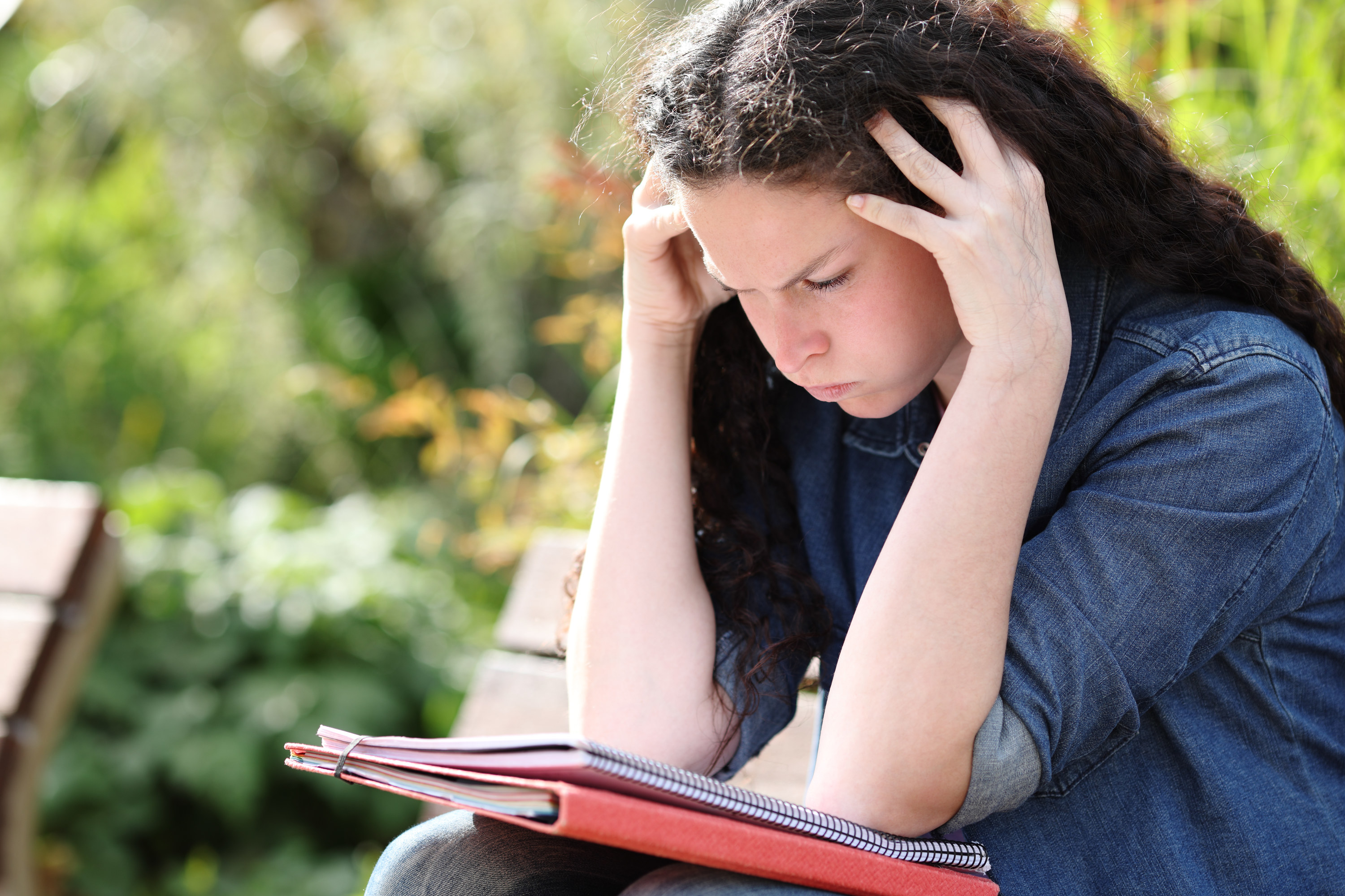 a woman looking frustrated at her papers