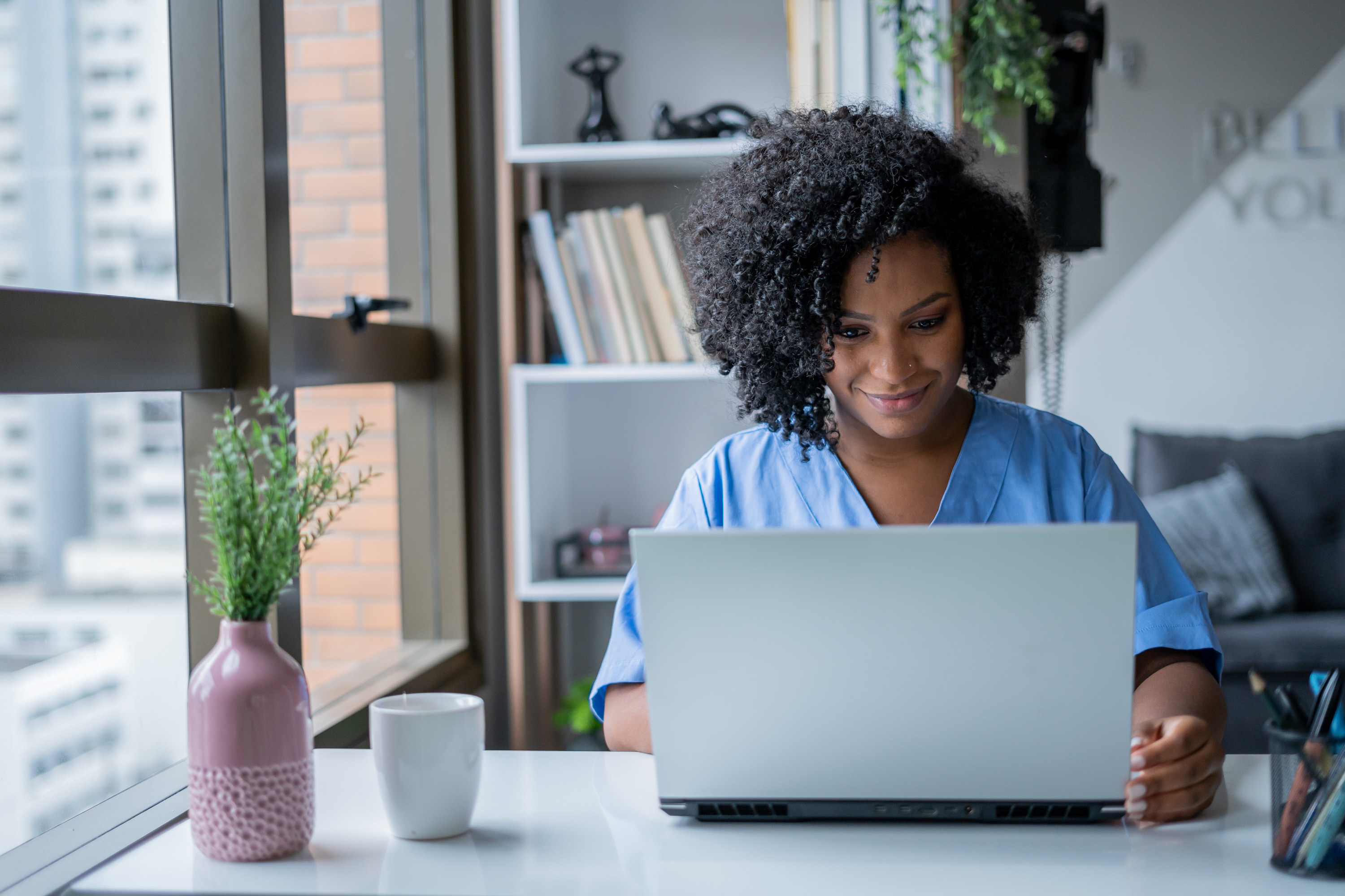 a woman working on a laptop