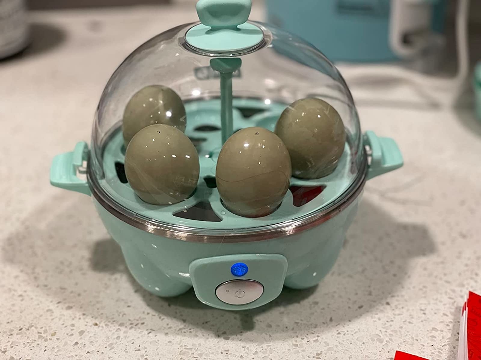 Reviewer image of eggs in blue egg cooker