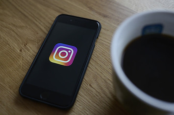 The Instagram logo is seen on an iphone.