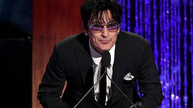 The Mötley Crüe drummer says he was attacked in bed while at his home in Calabasas.