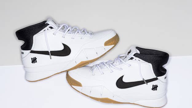 Official release information for the Undefeated x Nike Kobe 1 Protro 'White/Gum.'