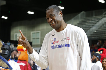 Dikembe Mutombo smiles before the NBA Cares Unified Basketball Game.