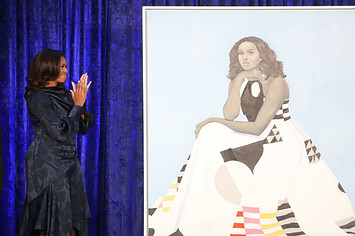 Michelle Obama with her portrait at the Smithsonian's National Portrait Gallery.