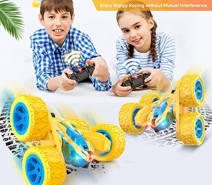 Two kids playing with cars