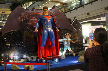Fans visit the 'Batman v Superman: Dawn of Justice' exhibition area