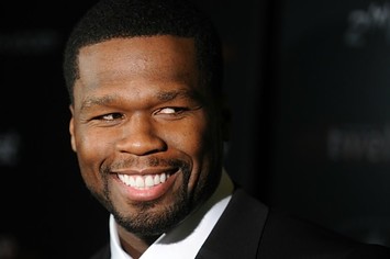 50 Cent smirks.