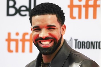 Drake smiles.
