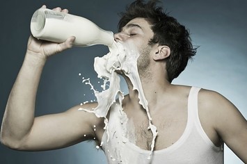 Man drinking milk.