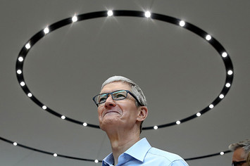 Apple CEO Tim Cook looks on during an Apple special event at the Steve Jobs Theatre